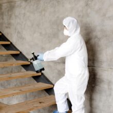 side-view-man-disinfecting-stairs