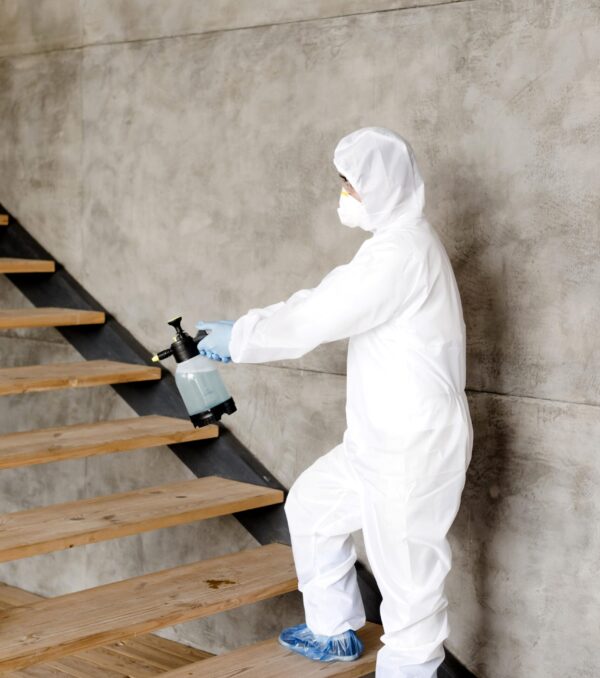 side-view-man-disinfecting-stairs